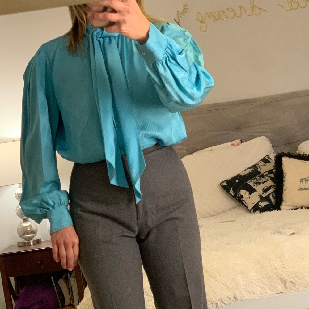Beautiful blue Yves Saint Laurent silk blouse with neck tie.